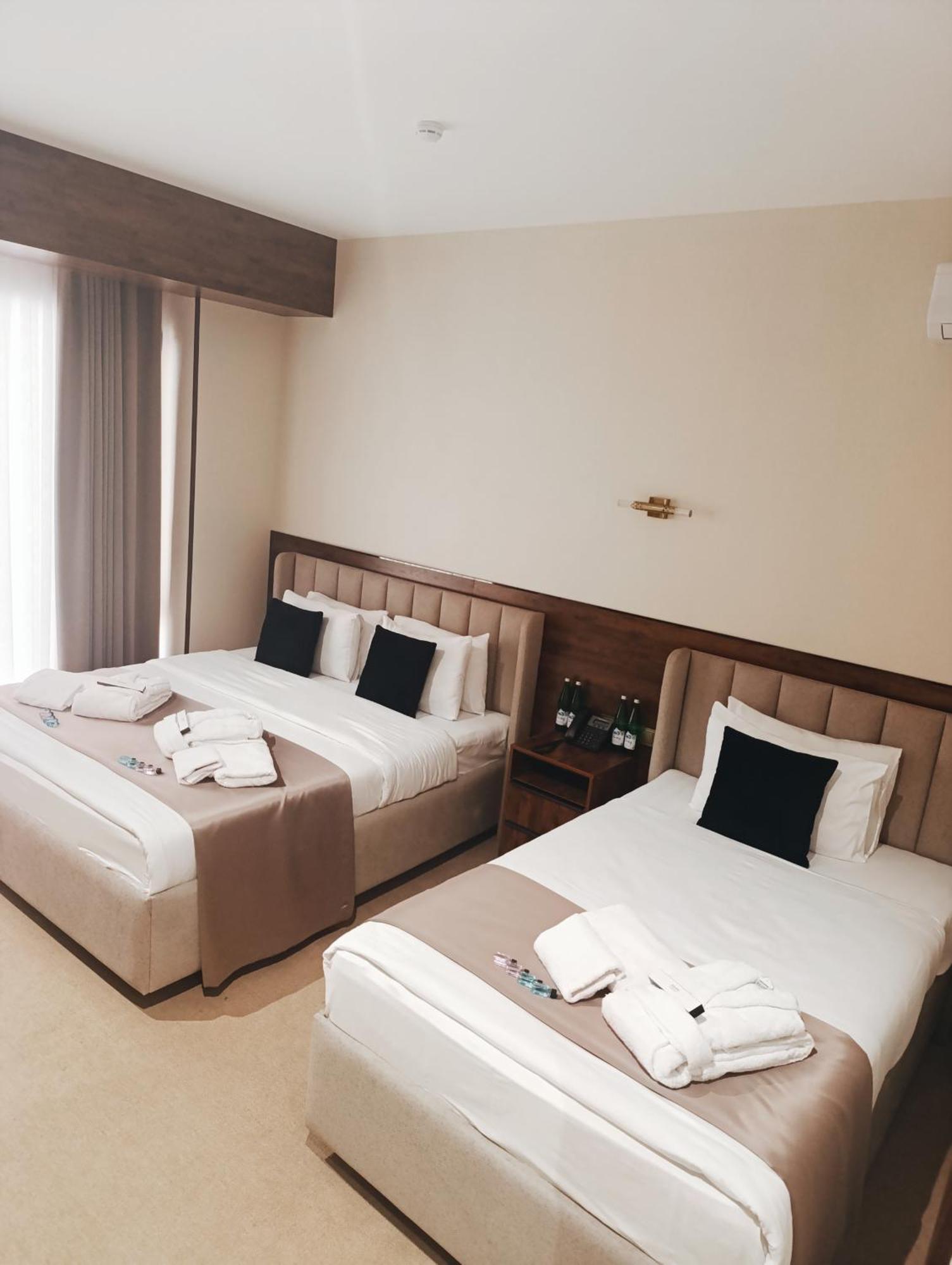 Grand Karavan Hotel Tasken Szoba fotó